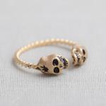 tiny skull heads ring in gold